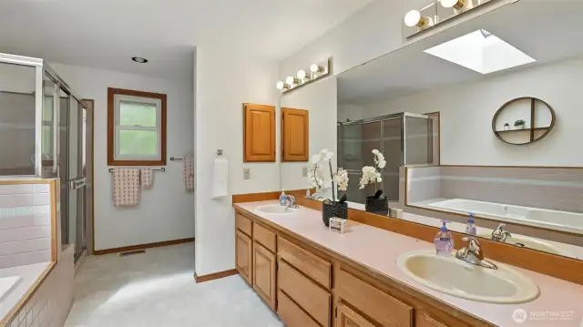 This double vanity and ample storage offer convenience and organization in the spacious primary bath