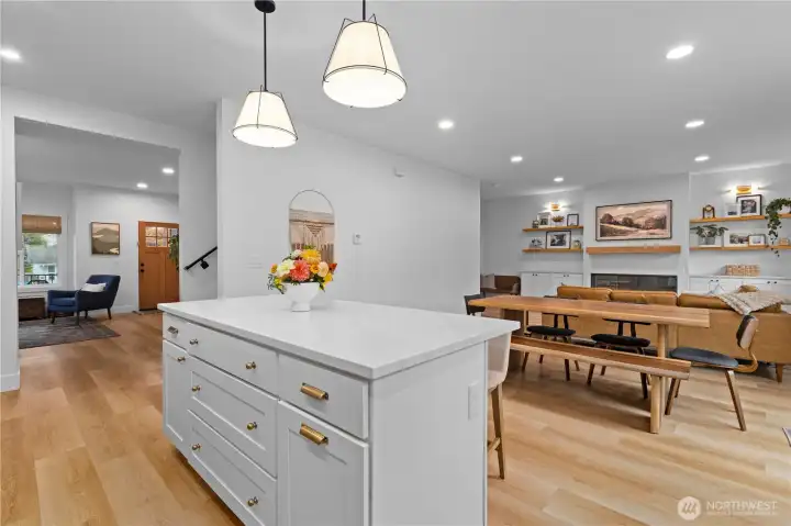 The kitchen flows into the dining area and family room beyond.