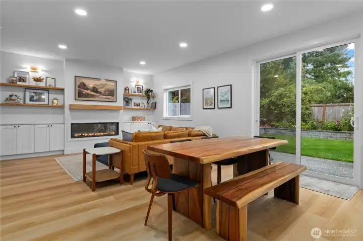 Cozy up to the fireplace in the living room. Built in cabinets surround the fireplace.