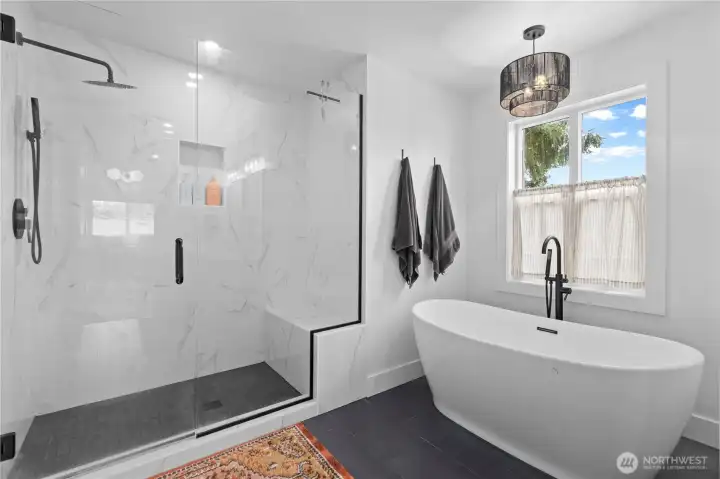 Five piece ensuite primary bathroom has a soaking tub and shower.