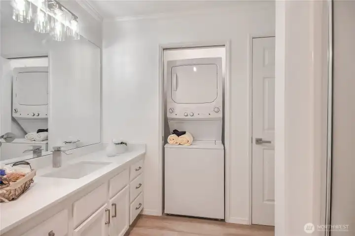 Bathroom with stacking Washer and Dryer in closet