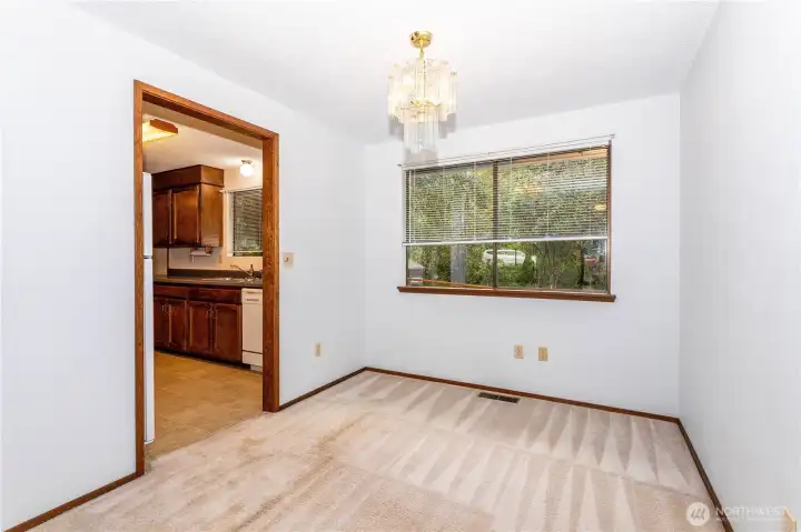 Dining room, adjacent to living room, the kitchen is to the left.