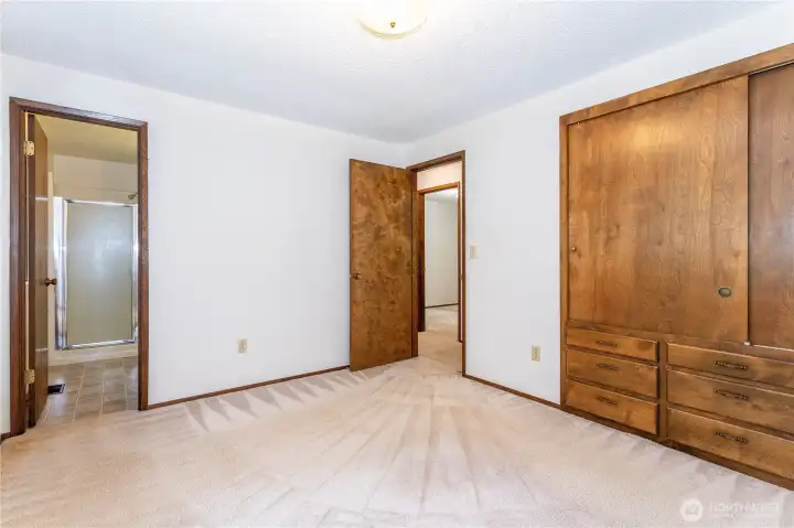 Lots of storage in primary bedroom, bathroom to left.