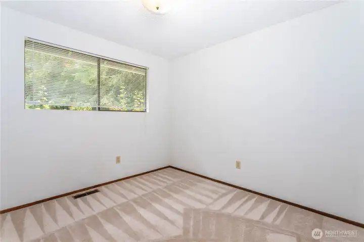 2nd bedroom, overlooking rear garden ara.