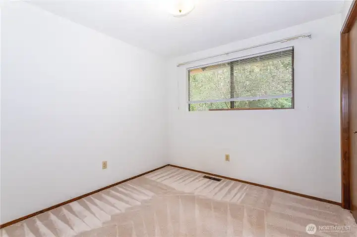 2nd bedroom, overlooking rear patio/garden
