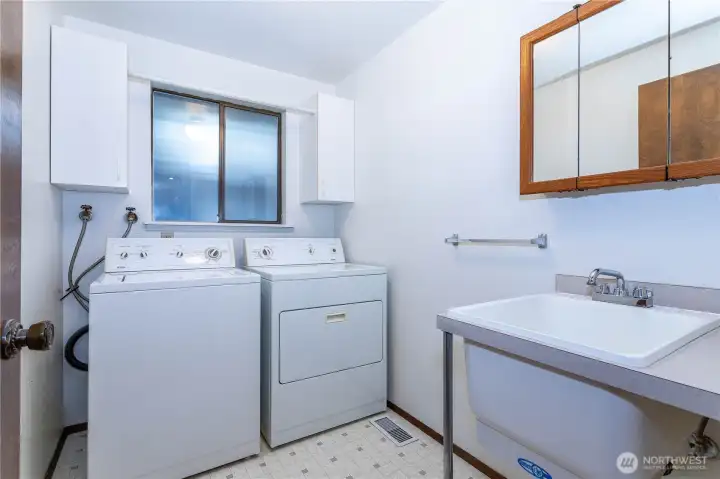 Spacious laundry room with laundry tub