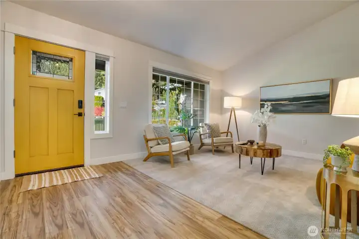 This cozy living area greets you with newer window, trim, flooring and more.  Great space for extended dining, entertaining, or home library.