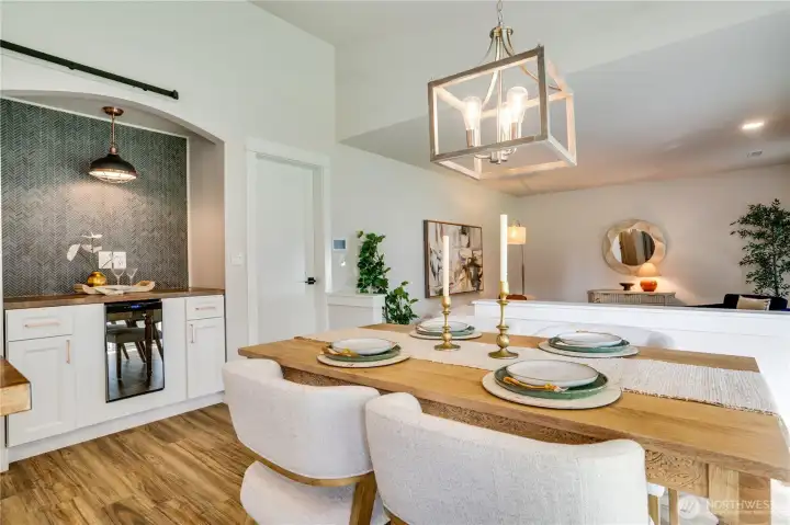 The closed door leads to a roomy two car garage, perfect for unloading groceries and sundries.