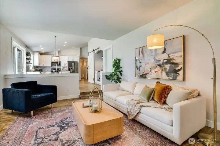 This generous family room is the perfect place to watch the game and enjoy the fire as you BBQ the wings on the patio.