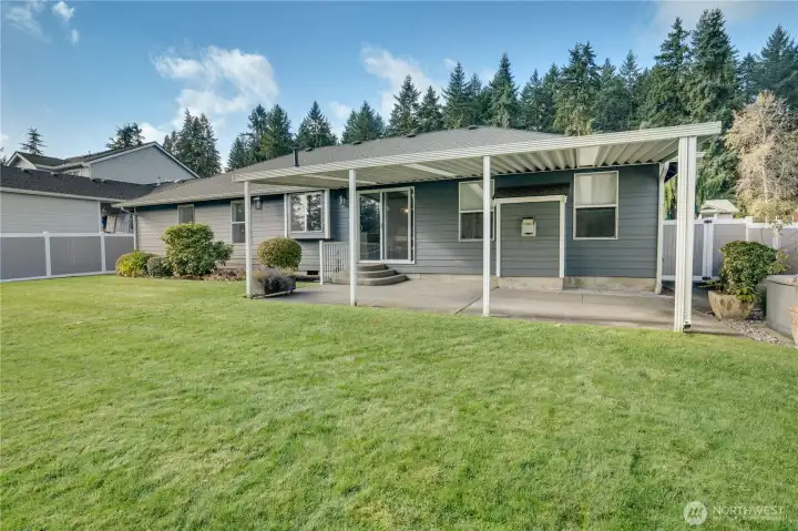 Natural gas generator ready if needed, covered extended patio space, and a feeling of privacy right in a central Puyallup location.