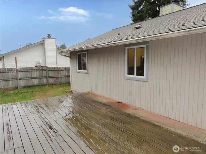 Sliding glass door leads to nice sized deck in private, back yard.