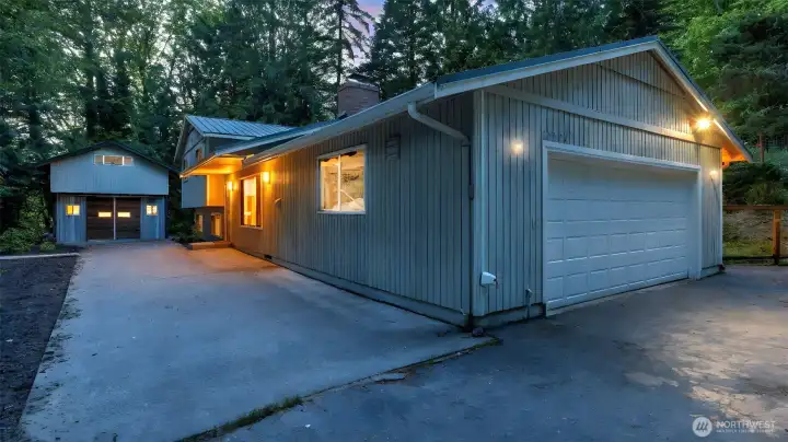 Enjoy an attached two car garage, driveway and a detached shop with loft for added storage!