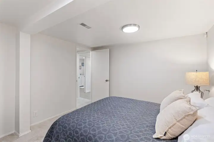 An alternate view highlights the room’s size and flexibility, easily accommodating use as a home office, media room, art studio, workshop, or guest space.