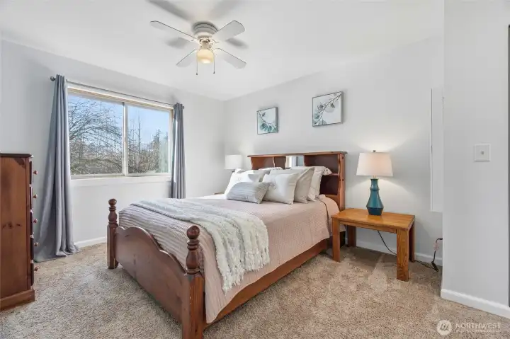 Primary Bedroom with en-suite 3/4 bath. South facing window lets in plenty of sunshine.