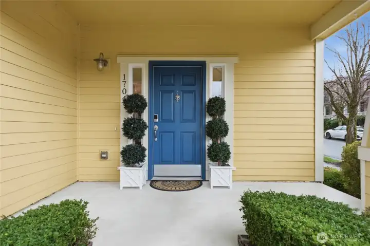 The covered front porch receives the afternoon sunshine.