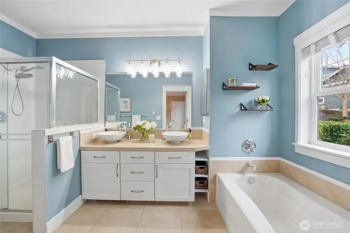 The primary bathroom is luxurious and bright!