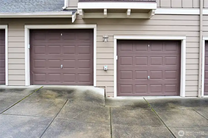 Two garage bays for parking and storage located behind the house.