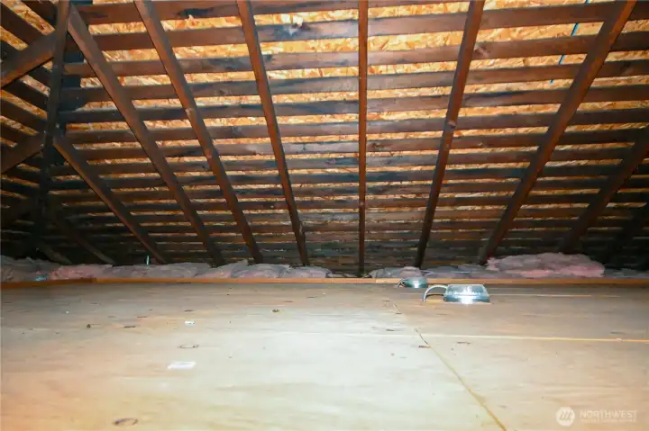 Attic includes finished flooring and offers exceptional storage space.