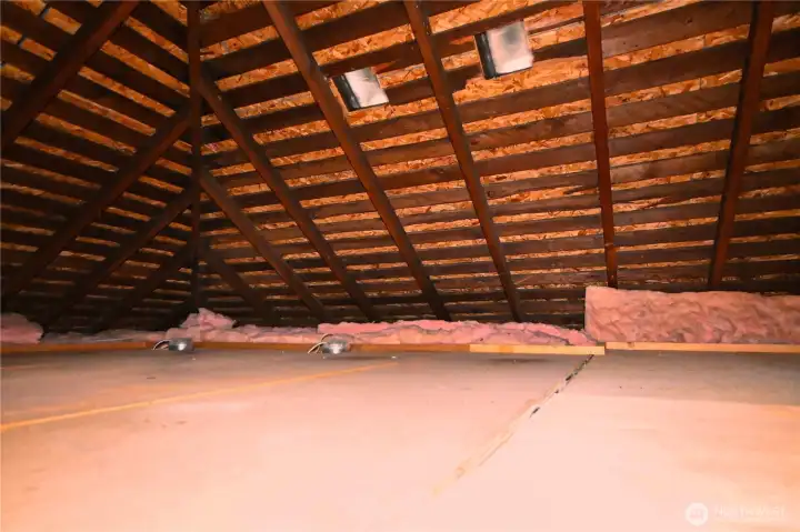 Attic includes finished flooring and offers exceptional storage space.
