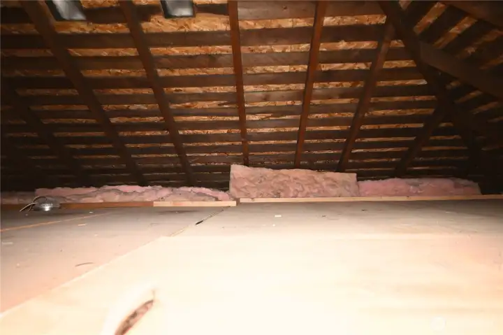 Attic includes finished flooring and offers exceptional storage space.