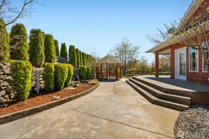 Beautiful walk way leads to gazebo and water feature
