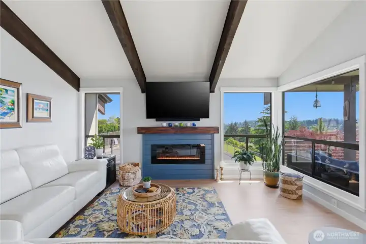 Updated electric fireplace insert offers cozy ambiance at the flip of a switch—plus the option to convert back to wood burning if you prefer a traditional fire experience.