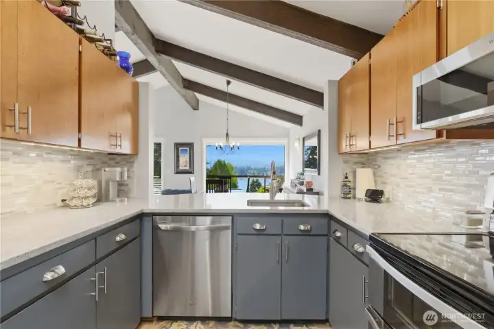 Efficient kitchen layout with great countertop flow—making prep and cooking easy, all complemented by sleek stainless steel appliances.