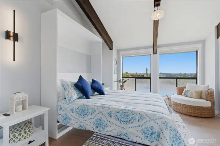 Murphy bed shown in the down position—easily transforming the space into a comfortable bedroom when needed.
