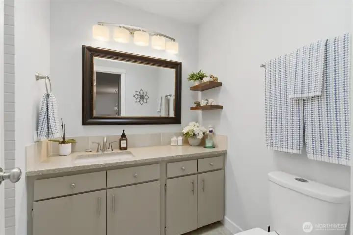 Clean, modern main-level bathroom—fresh, updated, and designed with a simple, timeless style.