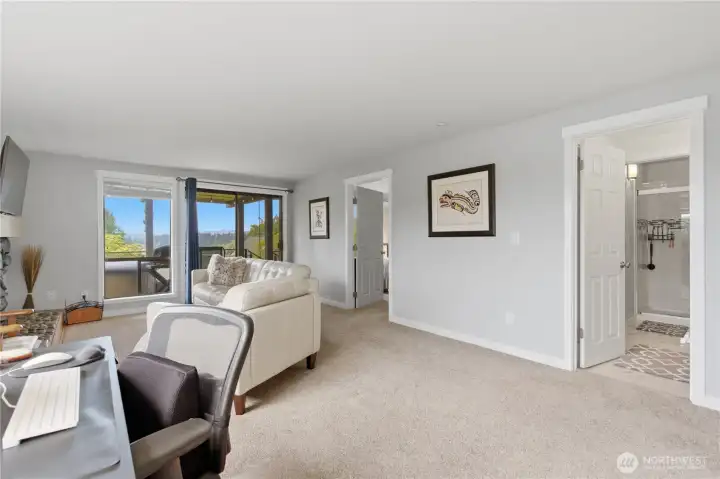 Lower level lives like a full private suite—featuring the primary bedroom, updated bathroom, and its own living room, with direct access to the outdoor hot tub for the ultimate retreat experience.