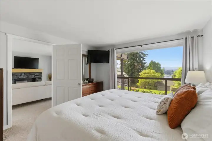 Primary bedroom lives like a private suite, with a dedicated living area just outside the door—perfect for relaxing, unwinding, or creating your own retreat space.