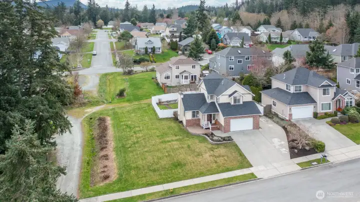 Home is perfectly positioned next to a right-of-way, providing extra yard space and added privacy.
