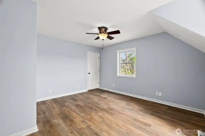 Level 2 Bedroom with door to additional attic storage Level 2 Bedroom with door to additional attic storage