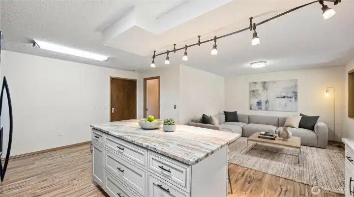 Kitchen flows seamlessly into the family room making it easier to hang out while preparing your awesome meals- Virtually staged
