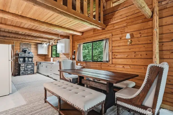 The dining area offers a welcoming space for meals and cabin gatherings