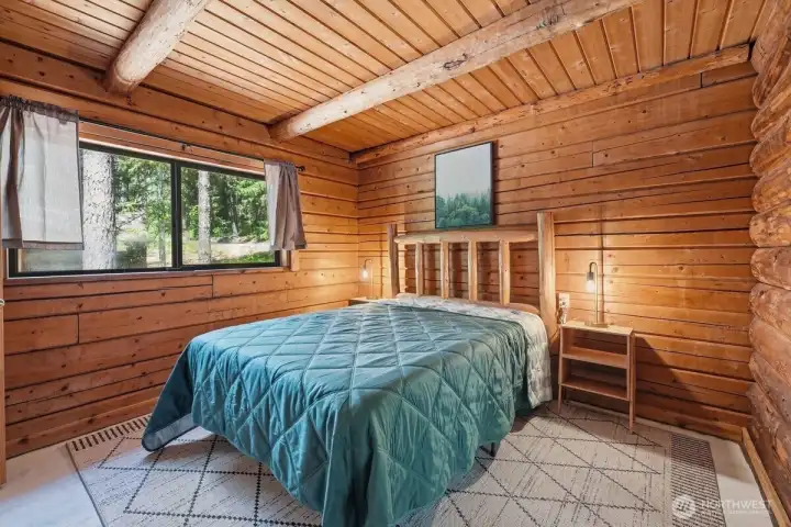 Wake up to peaceful surroundings in this inviting primary retreat on the main floor