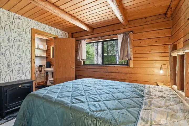 Spacious primary bedroom with its own electric stove