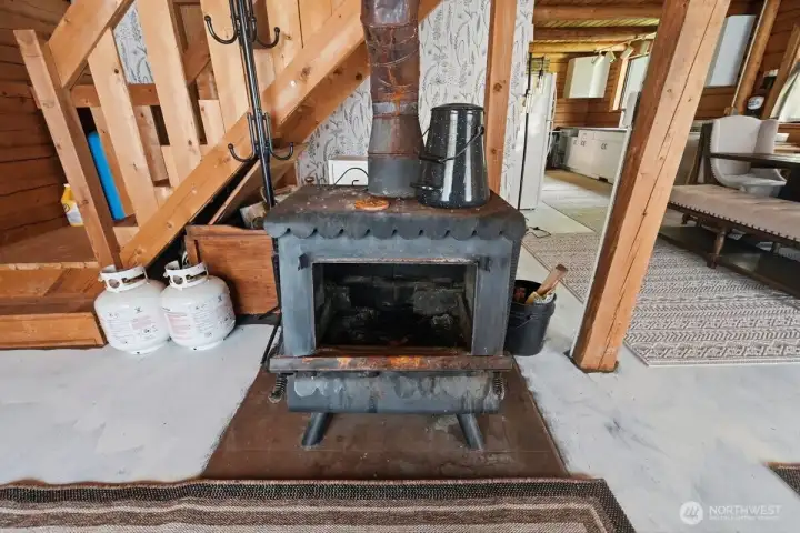 A wood stove adds warmth, comfort, and classic mountain cabin feel