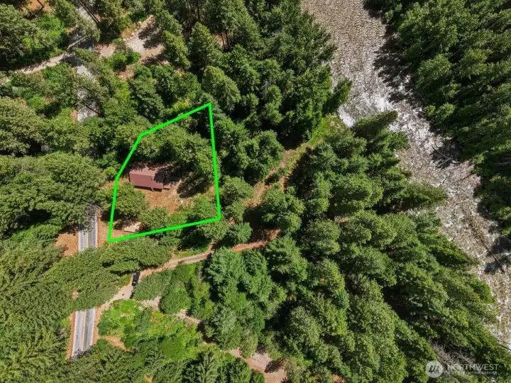 Nestled among the trees on approximately 1/3 acre