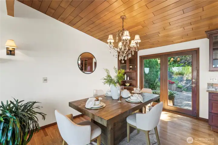 Vaulted ceilings and french doors to back deck provide an easy pass through for all. Vaulted ceilings and french doors to back deck provide an easy pass through for all.