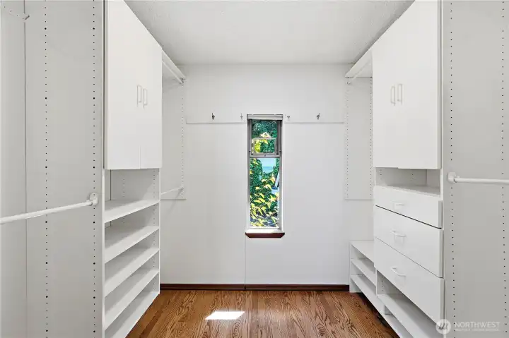 Primary walk-in closet. Primary walk-in closet.