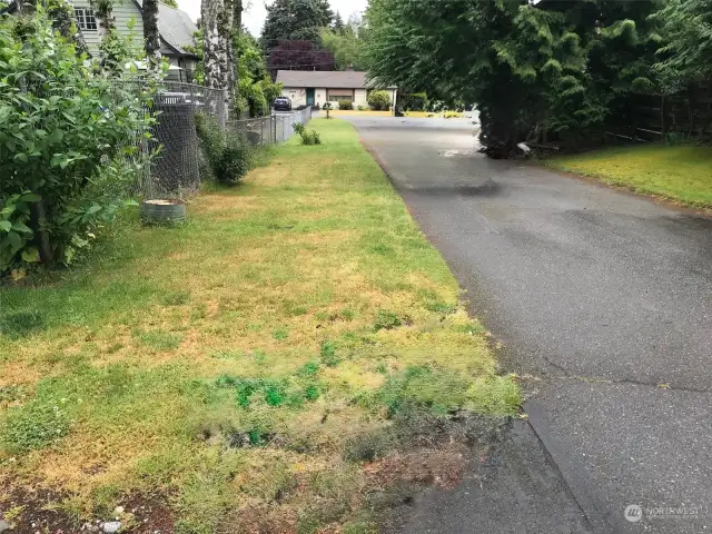 The "flag" part of the driveway.