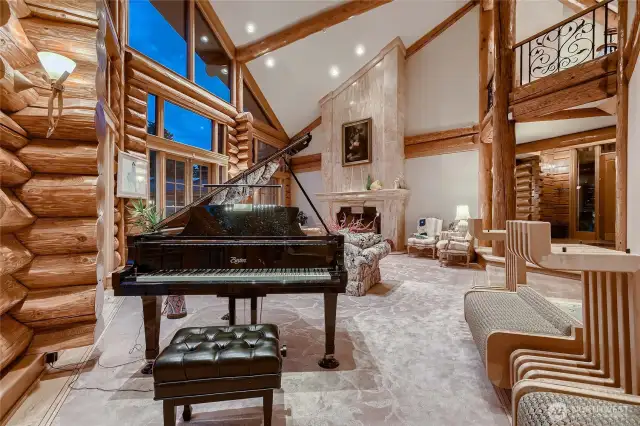 Living Room with 4 sets of double doors to the patio and facing the mountain.
