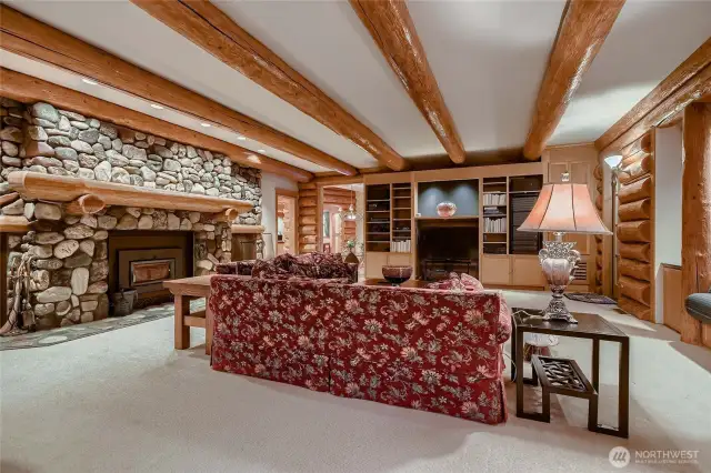 Facing the river rock fireplace.