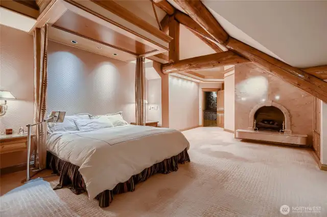 Primary Suite with fireplace and view to the Snoqualmie River.