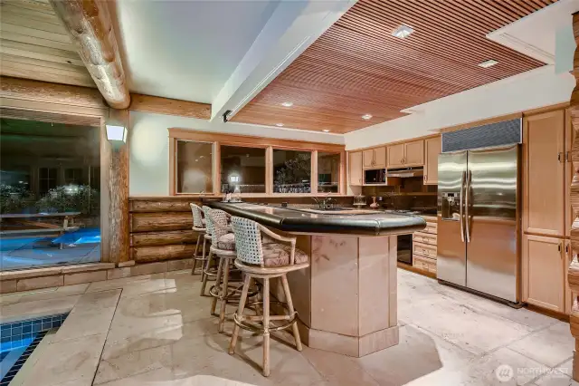 Second full kitchen serving the pool area.