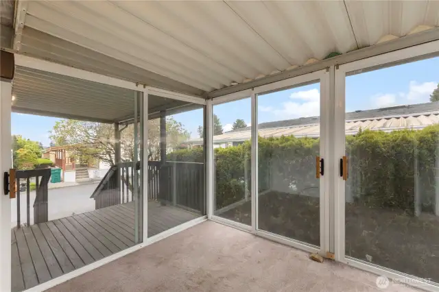 Sunroom with slider doors on all sides.