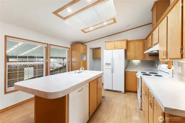 Features kitchen island and plenty of cabinet storage
