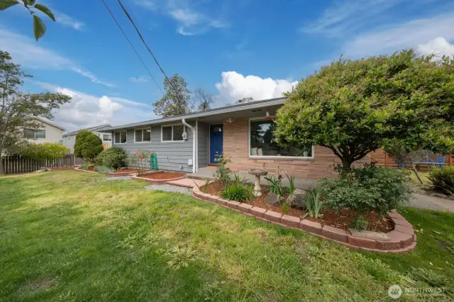 Step into the Burien rambler lifestyle—fully turnkey inside, with outdoor space ready for your green thumb to shine.