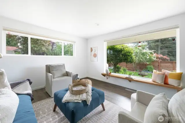 Experience an open flow leading to the living room, showcasing over $100K in thoughtful upgrades.